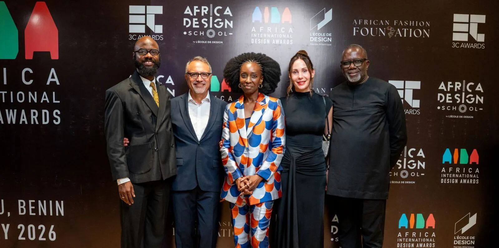 Five guests at the 2026 AIDA Awards in front of an event backdrop featuring the African Fashion Foundation.