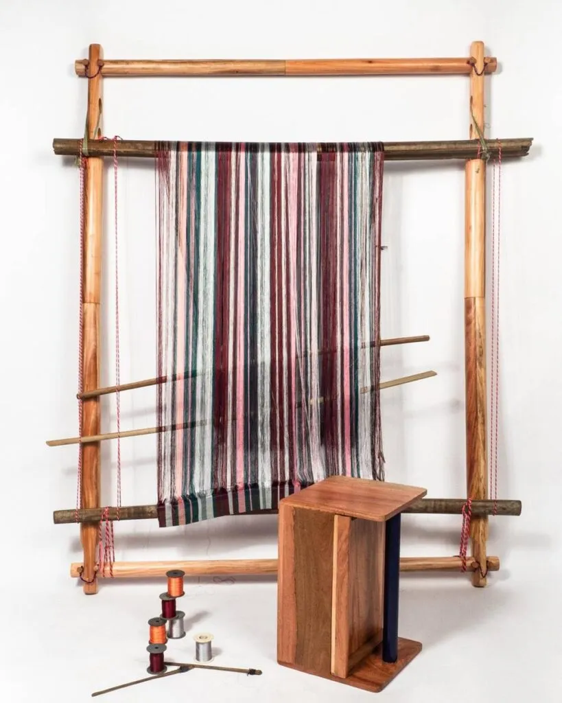 Weaver working at a traditional loom